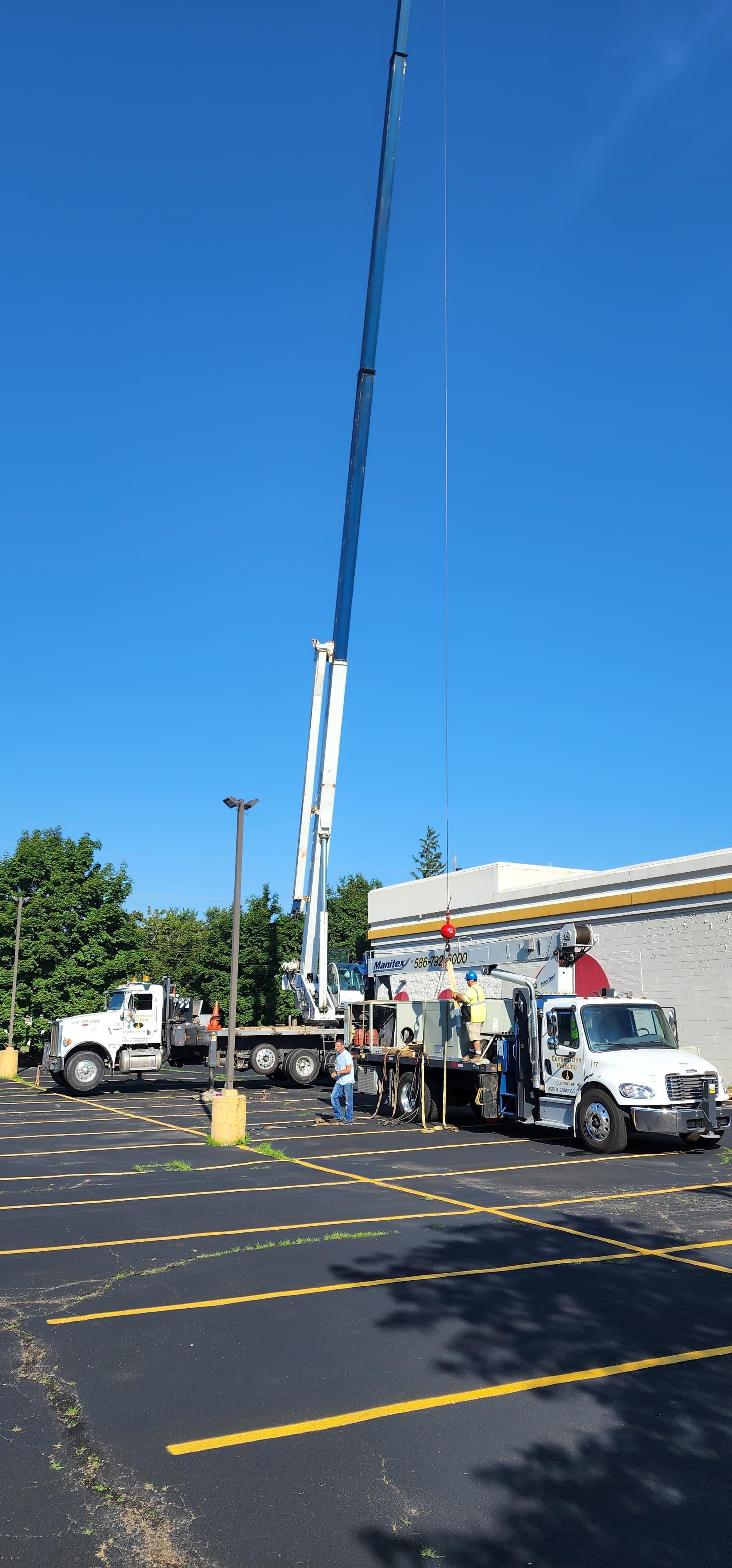 Crane setup before lifting rooftop HVAC equipment into place